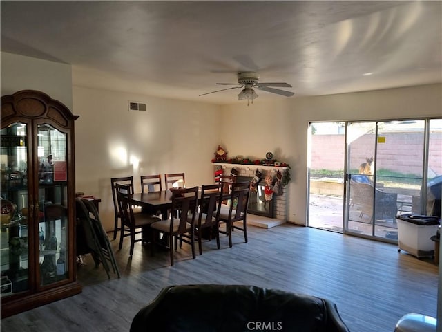 dining room featuring ceiling fan and wood-type flooring