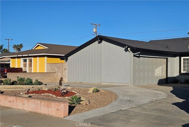 view of side of property with a garage