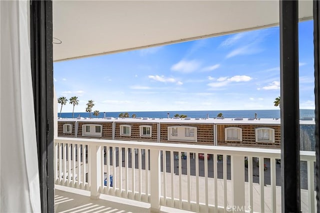 balcony featuring a water view