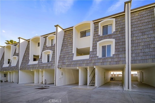 11862 Starfish Ln, Malibu, CA 90265 - view of building exterior featuring stairway and a carport