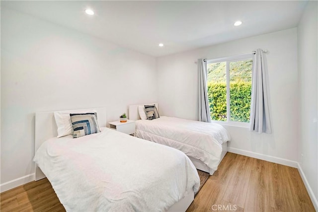 bedroom featuring wood-type flooring