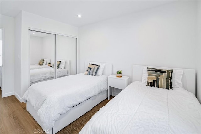 bedroom featuring a closet and hardwood / wood-style flooring