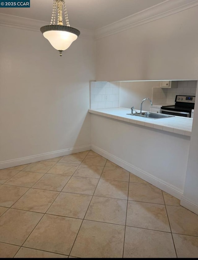 interior space featuring sink and crown molding