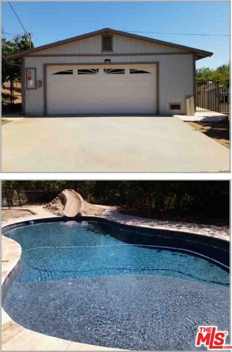 view of pool with an outbuilding, a water slide, and a garage