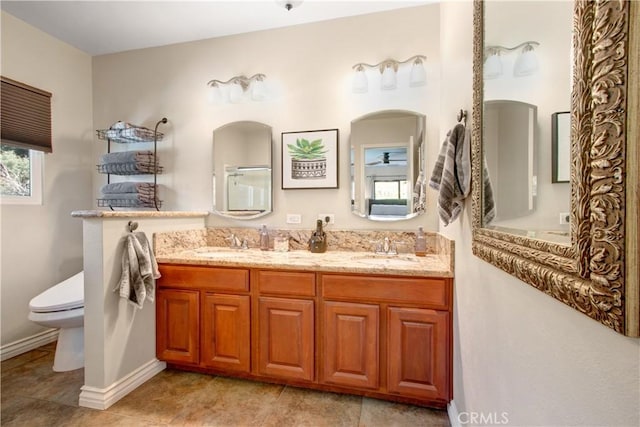 bathroom featuring toilet and vanity