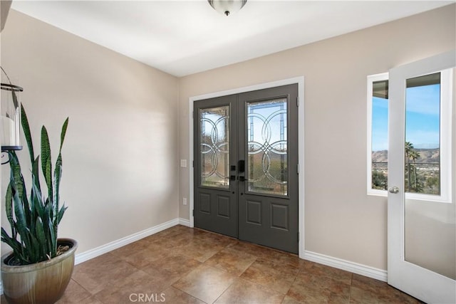 foyer entrance featuring french doors