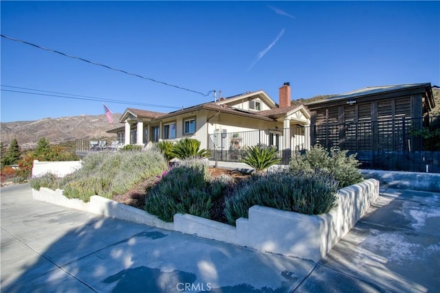 view of front of home with a mountain view