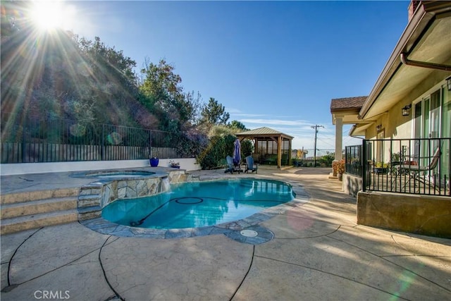 view of swimming pool featuring an in ground hot tub, a gazebo, and a patio