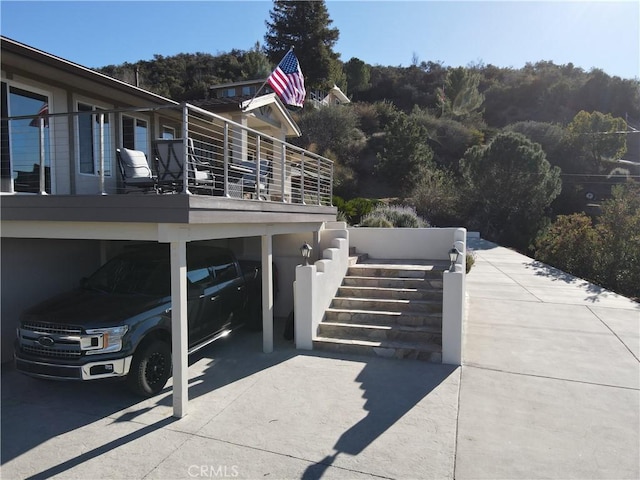 view of side of property with a carport