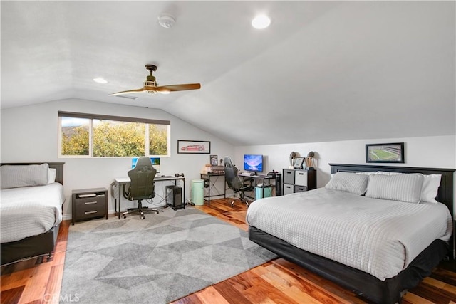 bedroom featuring light wood-type flooring, ceiling fan, and vaulted ceiling