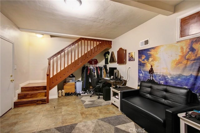 living room featuring beam ceiling