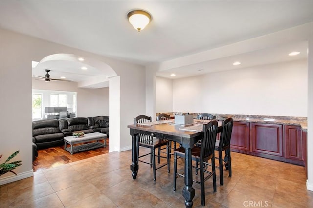 dining room featuring ceiling fan and light tile patterned flooring