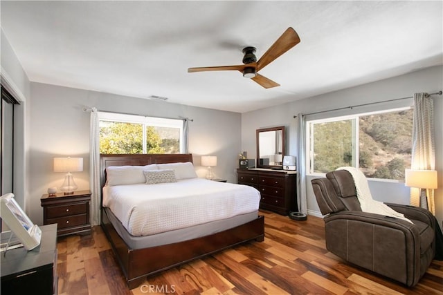 bedroom featuring ceiling fan and dark hardwood / wood-style flooring