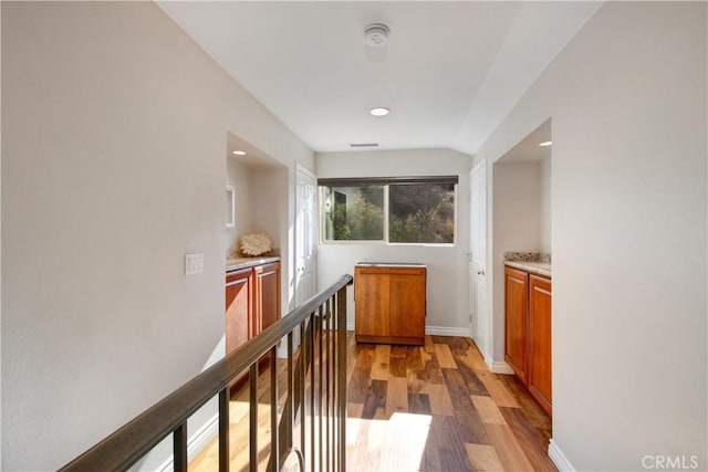 hall with light hardwood / wood-style floors