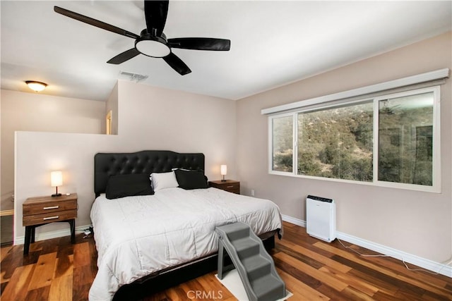 bedroom featuring ceiling fan and dark wood-type flooring