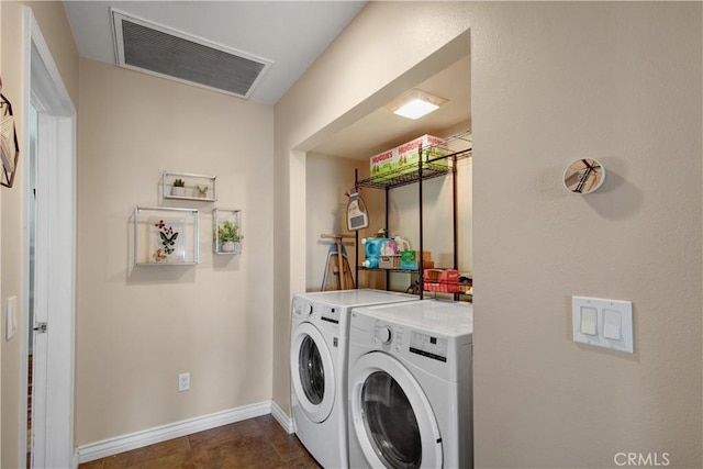 laundry room featuring separate washer and dryer