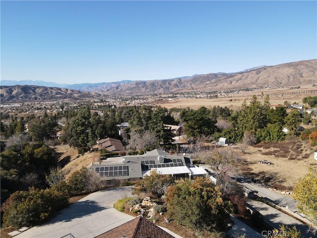 birds eye view of property with a mountain view