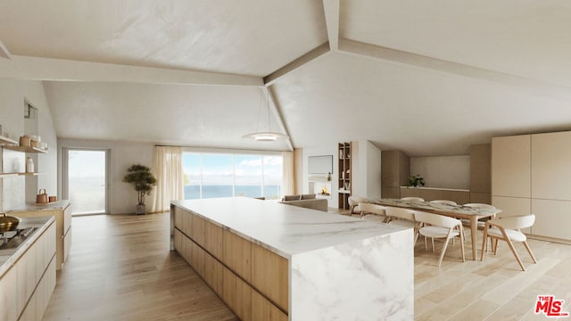 kitchen with light hardwood / wood-style floors, black electric cooktop, a large island, and vaulted ceiling with beams