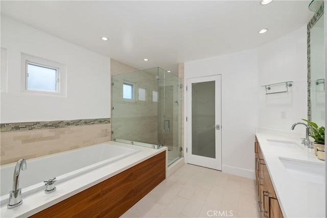 bathroom featuring vanity and plus walk in shower