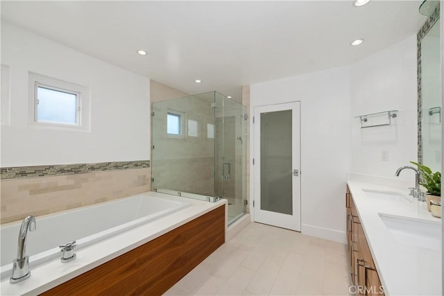 3308 Pacific Ave, Manhattan Beach, CA 90266 - bathroom featuring healthy amount of natural light, a bath, a shower stall, double vanity, and recessed lighting