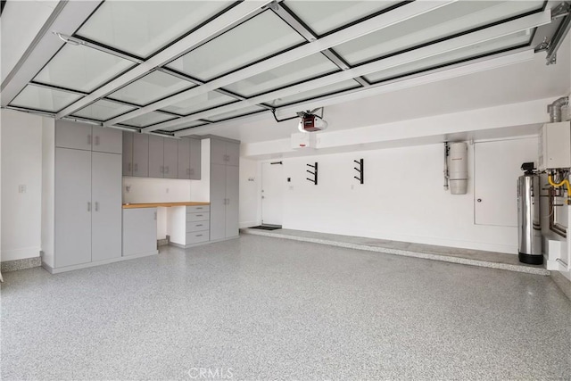 3308 Pacific Ave, Manhattan Beach, CA 90266 - garage with a central vacuum unit, a garage door opener, and baseboards
