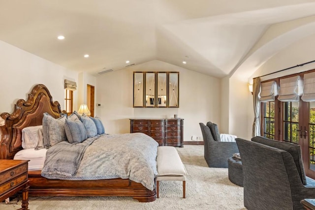 carpeted bedroom with vaulted ceiling