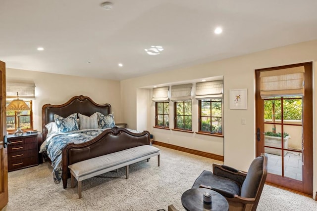 bedroom featuring light carpet