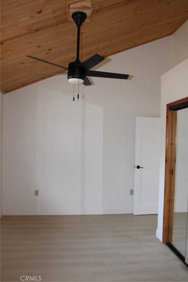 unfurnished room featuring light hardwood / wood-style flooring, vaulted ceiling, and wooden ceiling