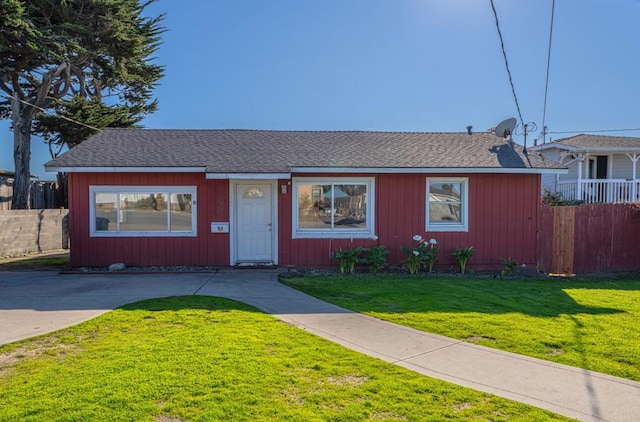 ranch-style home featuring a front yard