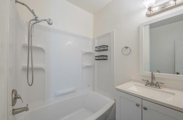 bathroom with washtub / shower combination and vanity