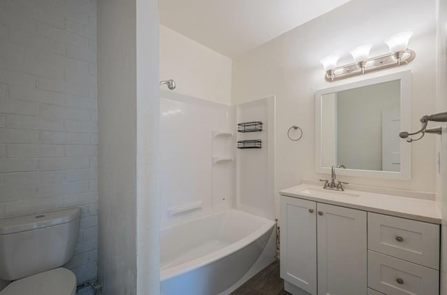 full bathroom with toilet, vanity, and shower / tub combination