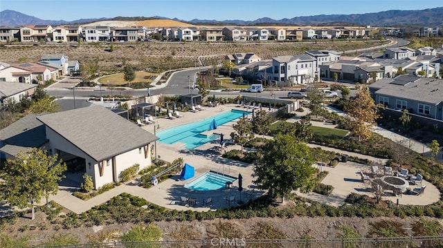 birds eye view of property featuring a mountain view