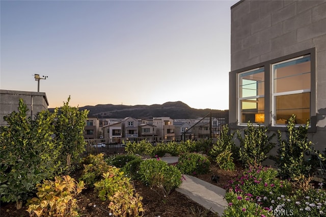 yard at dusk with a mountain view