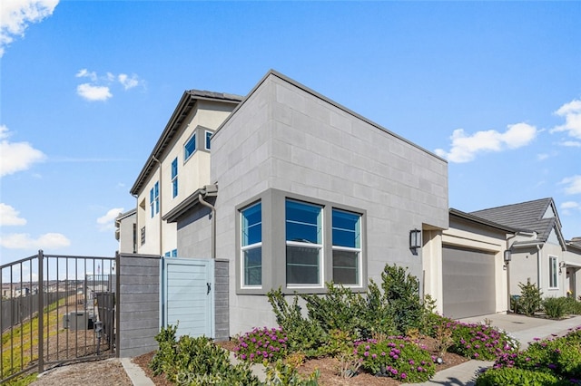 view of side of property with a garage