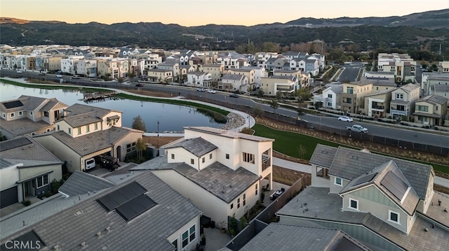 aerial view at dusk with a water view