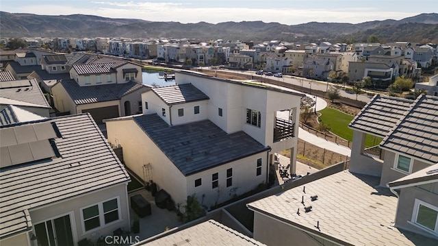 birds eye view of property featuring a mountain view