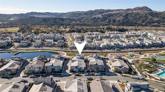 bird's eye view with a water and mountain view