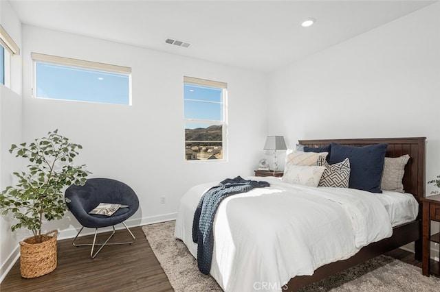 bedroom with hardwood / wood-style flooring