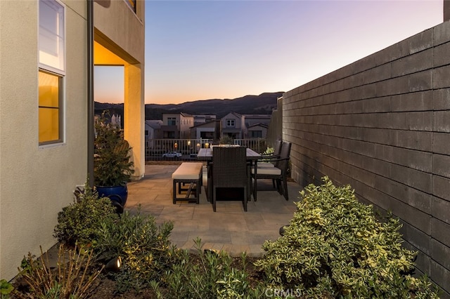 view of patio terrace at dusk