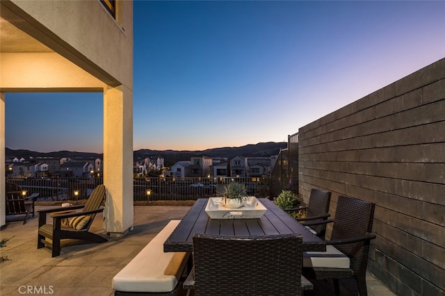 view of patio terrace at dusk