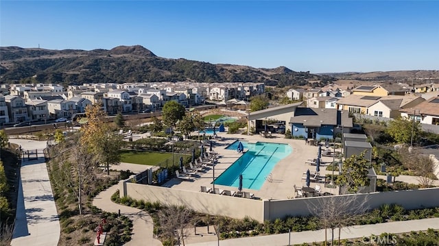 view of pool with a mountain view and a patio