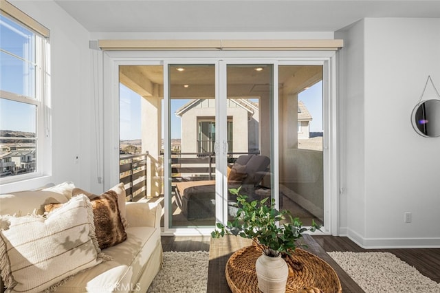 interior space featuring a healthy amount of sunlight and dark hardwood / wood-style flooring