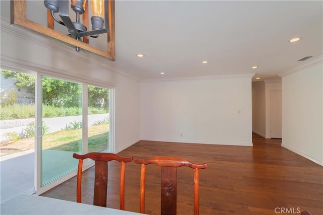 living room featuring dark hardwood / wood-style flooring and ornamental molding