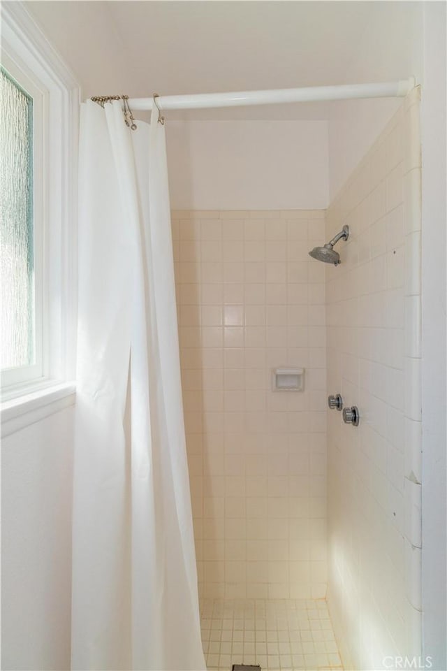 bathroom with a shower with shower curtain