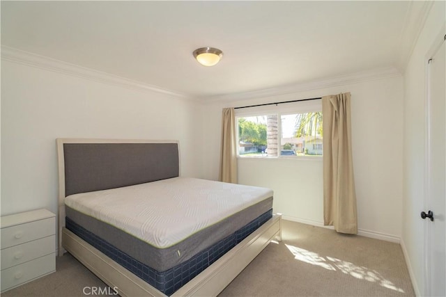 bedroom featuring light carpet and crown molding