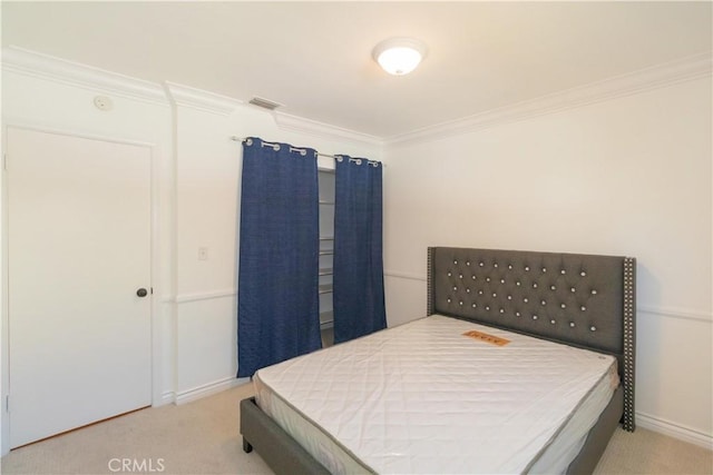 carpeted bedroom featuring ornamental molding