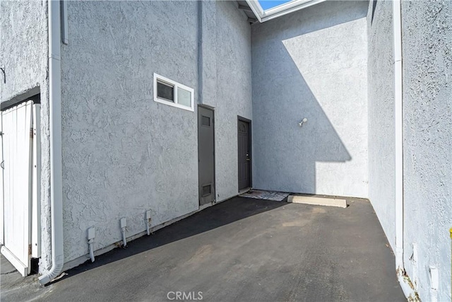 view of side of home with a patio area