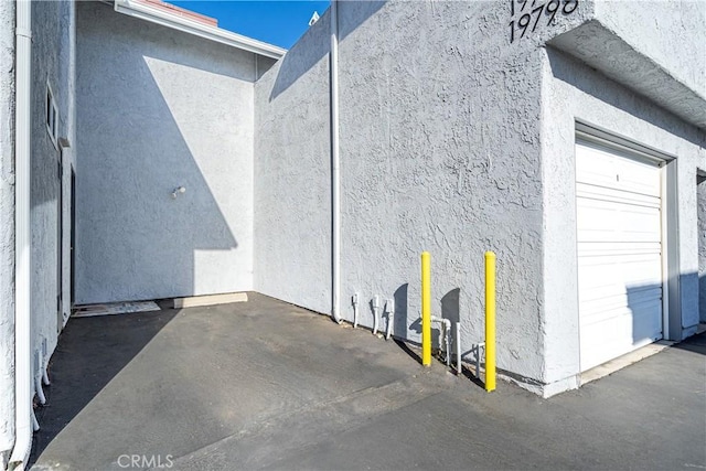 view of side of property featuring a garage