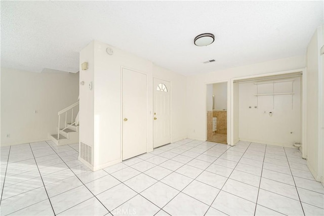 entryway featuring light tile patterned floors