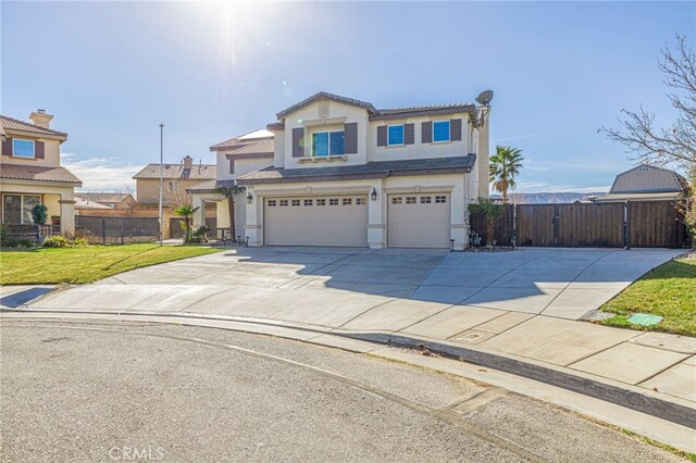 view of front of property with a front yard and a garage